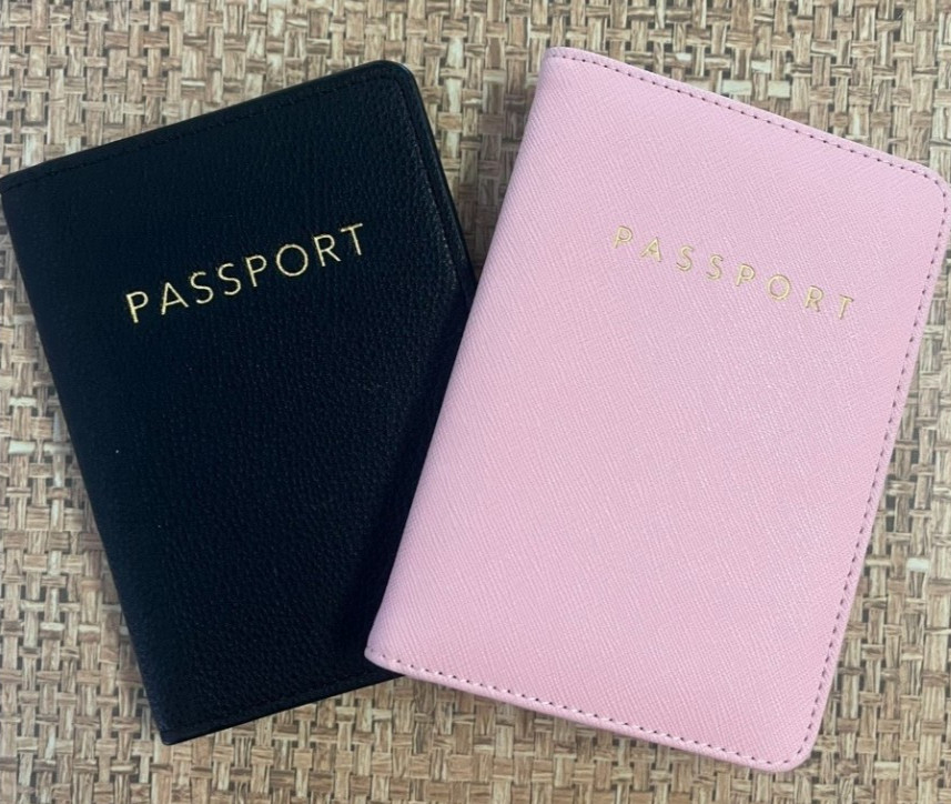 Two new passport covers for men and women (dark blue and pink).