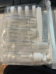 Travel Toiletry Bottle Kit Contained in a Transparent Plastic Zip Pouch