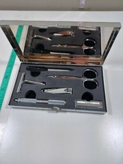 small travel kit scissors razor, nail clipers, nail file in silver color case